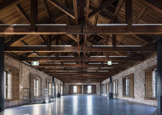 a large room with brick walls and a brick wall