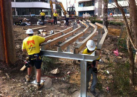 a group of men in hardhats working on a construction site