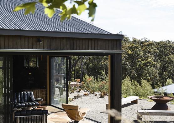 a building with a glass wall and a fireplace