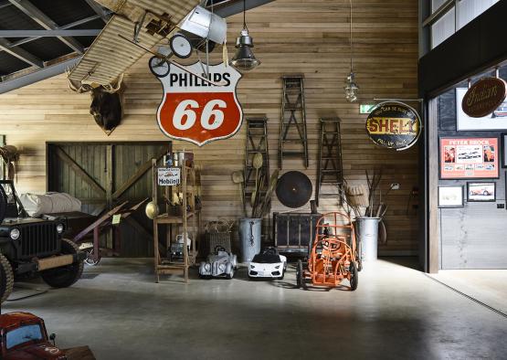 a room with a sign and objects on the wall