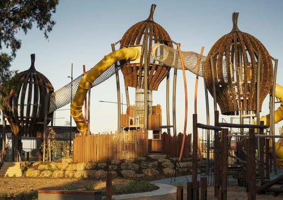 a playground with a yellow tube and a yellow tube