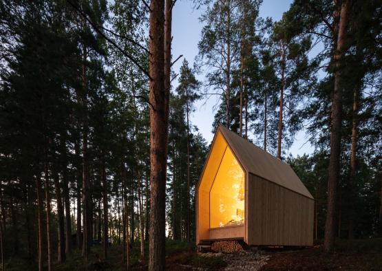 a small wooden house in the woods