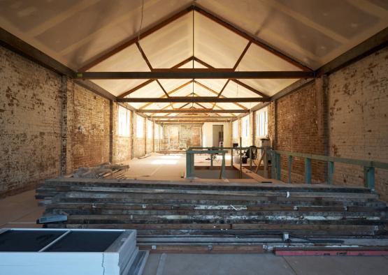 a building under construction with a brick wall