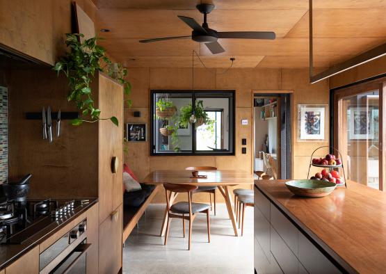 a kitchen with a table and chairs