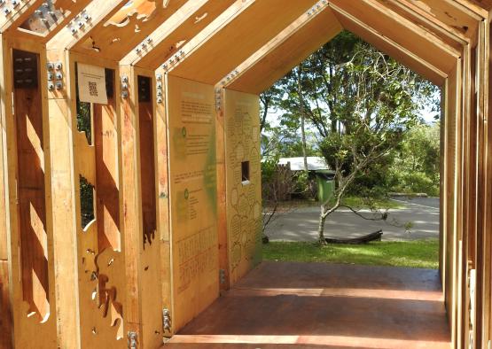 a wooden structure with a sign in the middle