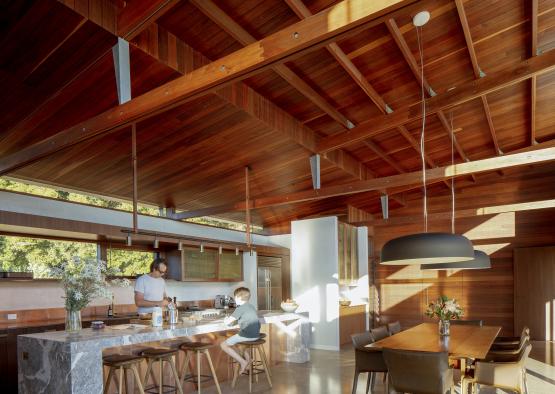 a large kitchen with a table and chairs
