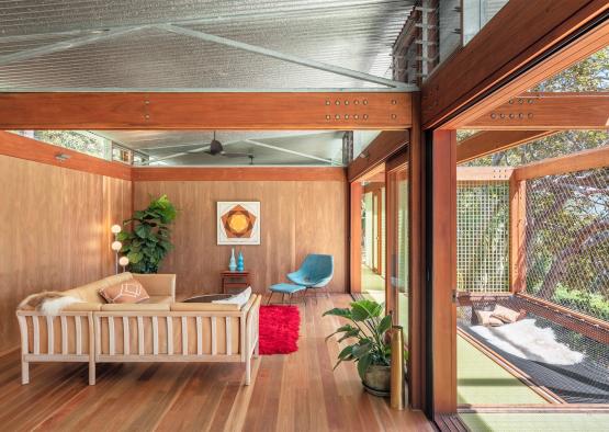 a room with a couch and chairs