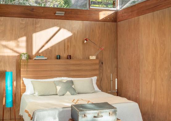 a bed with luggage on top of it