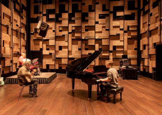 a group of people playing instruments on a stage