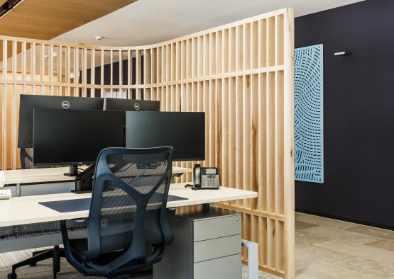 a desk with a chair and computer