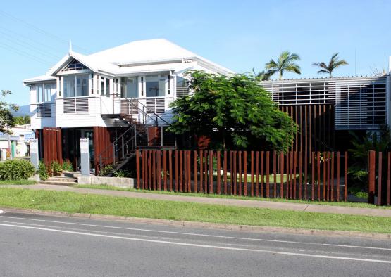 a house with a fence and grass