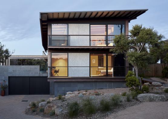 a house with a garage and a tree