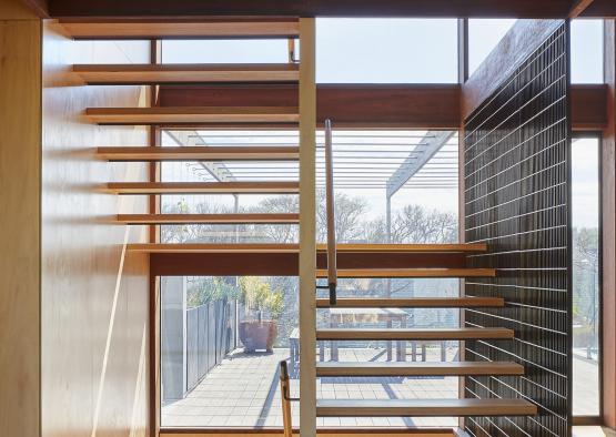 a staircase in a room with a window