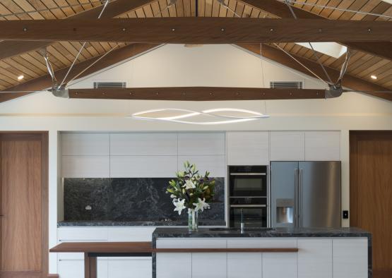 a kitchen with a marble countertop and a refrigerator