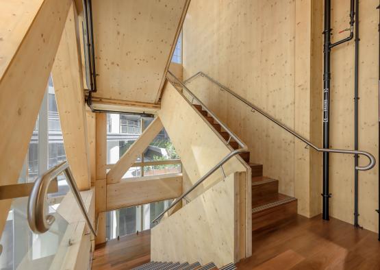 a wooden staircase with metal railings