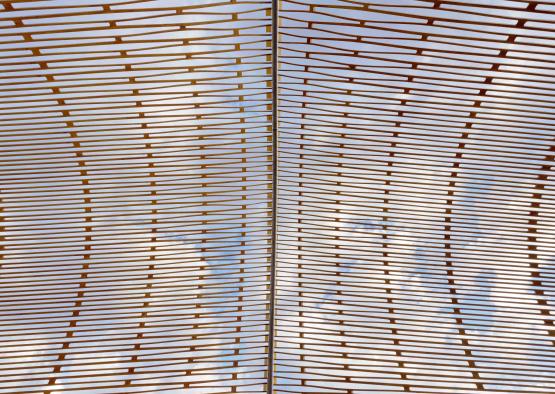 a structure with a blue sky and clouds