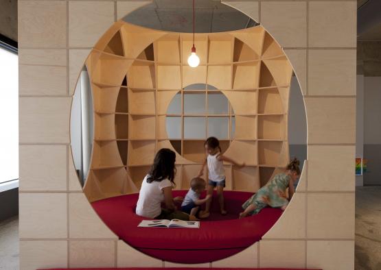 a group of children playing in a circular object