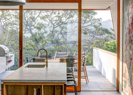 a kitchen with a large wall and a painting