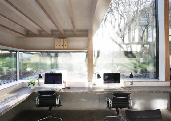 a room with windows and computers