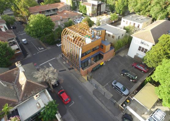 a building with a wood frame in a neighborhood