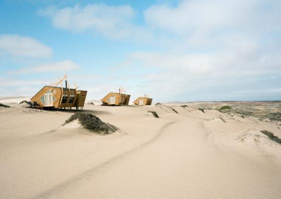 a group of houses in the desert