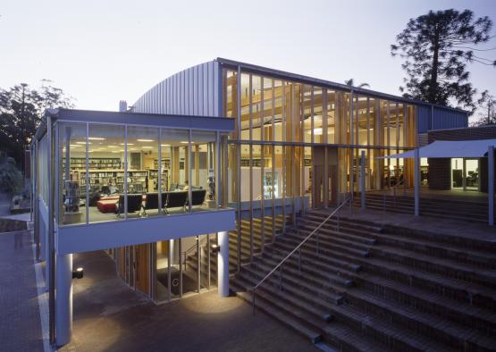 a building with stairs and glass walls