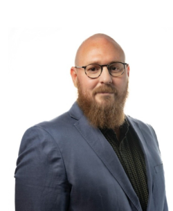 Dayne Davis Man with glasses and beard standing against white background