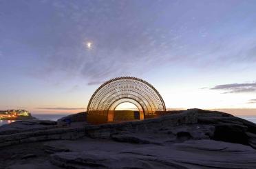 a structure on a rocky beach