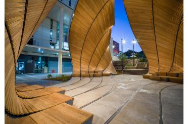 a wooden structure with curved walls